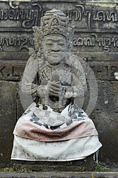 Local carved stone statue in Bali Asia Indonesia