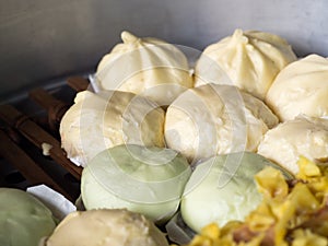 Local Chinese food steamed dumplings or steamed buns steaming in pot.