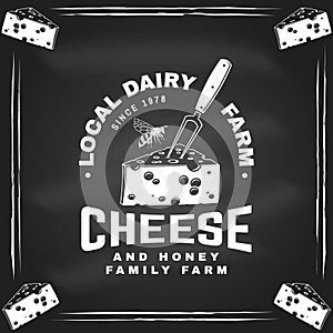 Local dairy farm badge design on the chalkboard. Template for logo, branding design with block cheese, fork for cheese