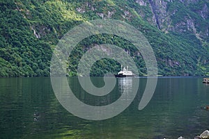 Local ferry boat operated in the large fjord in Aurland region. photo