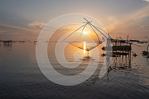 Local fishing trap net in canel, lake or river at sunset. Nature landscape fisheries and fishing tools lifestyle at Pak Pha,