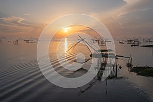 Local fishing trap net in canel, lake or river at sunset. Nature landscape fisheries and fishing tools lifestyle at Pak Pha,