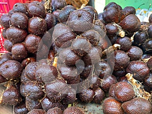 This is a local fruit in Indonesia, this fruit is usually called & x22;salak& x22; or snakefruit