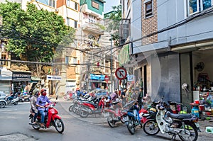 Local daily life of the street in Hanoi, Vietnam. People can seen having their food beside the street.