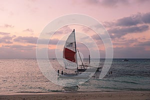Local Maldivian Boats near the Sandy Beach during the Sunset Time
