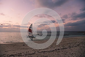 Local Maldivian Boats near the Sandy Beach during the Sunset Time