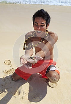 Local man holds up a sand crab