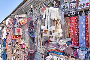 Local market with traditional national colorful souvenirs, fur and leather products, Kazakhstan