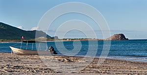 Local Mexican panga boat, beach sea and sky photo