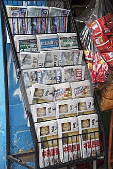 Local newspaper on a shelf for sale on the street in Johor Bahru