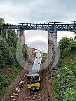 A local passenger train approaching Teignmouth station in Devon UK