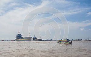 Local people using traditional boat in the middle of Musi River, Palembang, Indonesia.