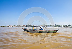 Local People using traditional boat for transportation in the middle of Musi River, Palembang, Indonesia.