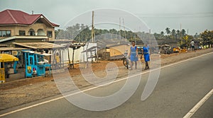 Local residents are walking along the street in Cape Cost