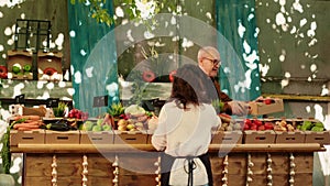 Local stand holders preparing farmers market counter