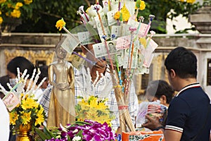 Local thai people join rite ritual Tak Bat Devo Buddhism festival and give food offerings to Buddhist monks in Tak Bat Thewo