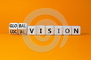 From local to global vision. Turned cubes and changed words `local vision` to `global vision`. Beautiful orange background, co