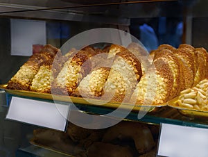 Local Traditional almond tiles, ALMOND SHINGLES, crunchy cookies, characteristic ribbed shape, Tejas de Almendra on tray for