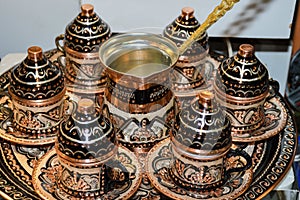 Local traditional handicraft tea and coffee pots and cups Turkish style