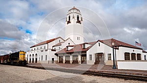 A local train depot with a locomotive on the tracks