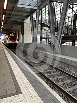 Local train in Switzerland coming to the station HardbrÃ¼cke in ZÃ¼rich