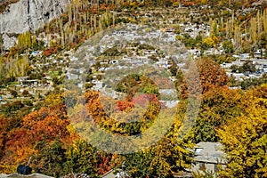 Local village surrounded by colorful trees in autumn season.