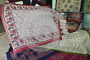 Local weaver displays dhurrie rugs