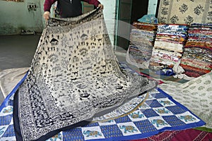 Local weaver displays dhurrie rugs