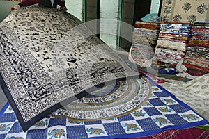 Local weaver displays dhurrie rugs