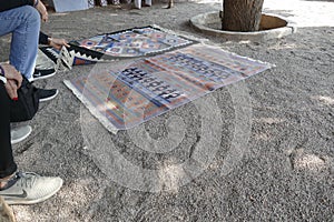 Local weaver displays dhurrie rugs