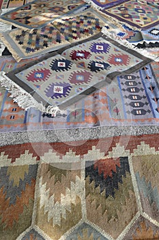 Local weaver displays dhurrie rugs