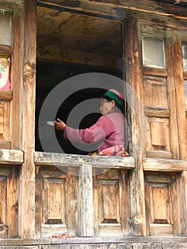 Local Weaver in window in India