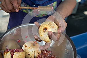 Local Woman Preparing Traditional Food by Hand in Thailand