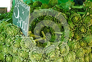 Locally-grown artichokes in a vegetable stall in Valparaisoâ€™s old grocery market, Chile