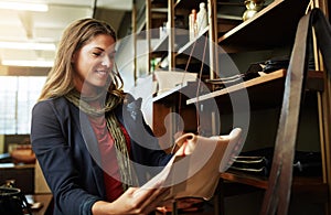 Locally made leatherwork. a young woman shopping in a leatherwork store.