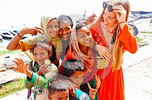 Locals embrace a tourist in Varanasi, India.
