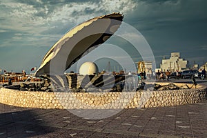 The pearl monument in Doha cor niche  daylight view with Doha skyline in background