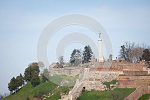 Victor statue on Kalemegdan fortress, seen from lower kalemegdan park during a afternoon.