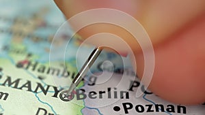 Location Berlin in Germany, push pin on map close-up, marker of destination for travel, tourism and trip concept, Europe