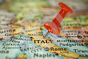 Location Italy, push pin on map close-up, marker of destination for travel, tourism and trip concept, Europe