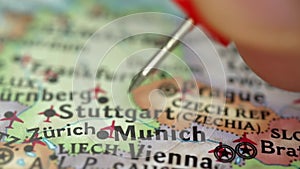 Location Munich in Germany, push pin on map close-up, marker of destination for travel, tourism and trip concept, Europe