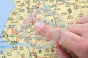 Location of North Korea`s capital Pyongyang on a finger map