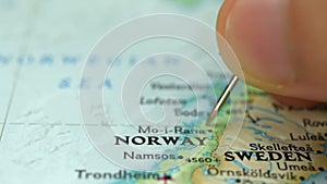 Location Norway, push pin on map close-up, marker of destination for travel, tourism and trip concept, Europe