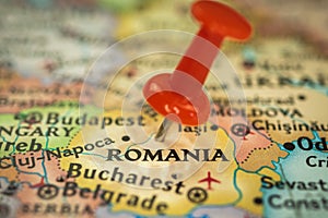 Location Romania, push pin on map close-up, marker of destination for travel, tourism and trip concept, Europe