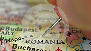 Location Romania, push pin on map close-up, marker of destination for travel, tourism and trip concept, Europe