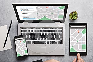 Location tracker concept on laptop, tablet and smartphone screen