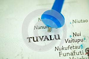 Location Tuvalu in Polinesia, map with push pin close-up, travel and journey concept photo