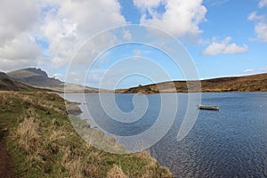 Loch Fada And The Old Man Of Storr In The Distance, Isle Of Skye. photo