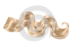 Lock of blonde wavy hair on white background