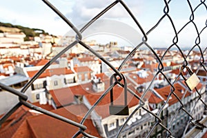 Lock on the cage, Old city on a background
